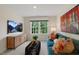 Relaxing living room with teal couch and large window at 255 Moore Creek Dr, Fuquay Varina, NC 27526