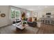 Open living room with gray sectional sofa and coffee table at 255 Moore Creek Dr, Fuquay Varina, NC 27526