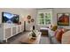 Comfortable living room with hardwood floors and ample natural light at 255 Moore Creek Dr, Fuquay Varina, NC 27526