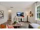 Spacious living room with hardwood floors and large window at 255 Moore Creek Dr, Fuquay Varina, NC 27526