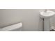 Small bathroom with pedestal sink and toilet at 273 Hanging Elm Ln, Fuquay Varina, NC 27526