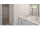 Double vanity bathroom with quartz countertop and large mirror at 273 Hanging Elm Ln, Fuquay Varina, NC 27526