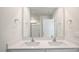 Double vanity bathroom with a quartz countertop and mirror at 273 Hanging Elm Ln, Fuquay Varina, NC 27526