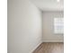 Simple bedroom with hardwood floors and a window at 273 Hanging Elm Ln, Fuquay Varina, NC 27526