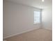 Bright bedroom with neutral walls and carpet at 273 Hanging Elm Ln, Fuquay Varina, NC 27526