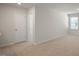 Bright bedroom with neutral walls and carpeting, offering ample space at 273 Hanging Elm Ln, Fuquay Varina, NC 27526