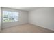 Spacious bedroom featuring a window with blinds at 273 Hanging Elm Ln, Fuquay Varina, NC 27526
