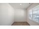 Simple bedroom with hardwood floors and a window at 273 Hanging Elm Ln, Fuquay Varina, NC 27526