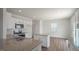 Modern kitchen with granite island and stainless steel appliances at 273 Hanging Elm Ln, Fuquay Varina, NC 27526