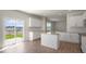 Kitchen features granite counters, white cabinets and backyard access at 273 Hanging Elm Ln, Fuquay Varina, NC 27526