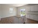 Eat-in kitchen with island, granite, and backyard view at 273 Hanging Elm Ln, Fuquay Varina, NC 27526