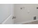 Laundry room with utility hookups and flooring at 273 Hanging Elm Ln, Fuquay Varina, NC 27526