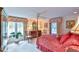 Bright bedroom with a post bed, ceiling fan, and hardwood floors at 304 Homestead Rd. Rd, Chapel Hill, NC 27516