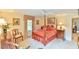 Spacious bedroom with a post bed, ceiling fan, and hardwood floors at 304 Homestead Rd. Rd, Chapel Hill, NC 27516