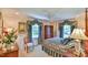 Bedroom with a post bed, ceiling fan and hardwood floors at 304 Homestead Rd. Rd, Chapel Hill, NC 27516