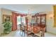 Formal dining room with a crystal chandelier and wood table at 304 Homestead Rd. Rd, Chapel Hill, NC 27516