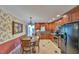 Eat-in kitchen with wood cabinets, granite countertops, and stainless steel appliances at 304 Homestead Rd. Rd, Chapel Hill, NC 27516