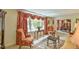 Elegant living room with ornate furniture and large windows at 304 Homestead Rd. Rd, Chapel Hill, NC 27516