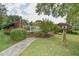 Inviting pool area with brick wall, steps, and surrounding landscaping at 304 Homestead Rd. Rd, Chapel Hill, NC 27516