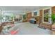 Relaxing screened porch with built-in grill and seating area at 304 Homestead Rd. Rd, Chapel Hill, NC 27516