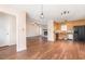 Kitchen features wood cabinets, stainless steel appliances, and hardwood floors at 3332 Castlegate Dr, Raleigh, NC 27616