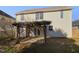 Home's exterior showcasing a pergola and patio at 351 Stobhill Ln, Holly Springs, NC 27540