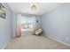 Cozy bedroom with hanging chair and light blue walls at 3805 Hamlin Ct, Raleigh, NC 27616