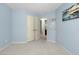 Blue bedroom with closet and soft, neutral-colored carpet at 3805 Hamlin Ct, Raleigh, NC 27616