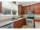 Kitchen boasts stainless steel appliances, ample counter space, and stylish cabinetry at 3805 Hamlin Ct, Raleigh, NC 27616