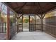 Relaxing screened gazebo with wood flooring and access to backyard at 4331 Karlbrook Ln, Raleigh, NC 27616