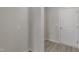 Clean and simple hallway with light gray walls and wood flooring at 45 Covey Rise Way, Lillington, NC 27546