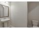 Simple powder room with pedestal sink and toilet at 45 Covey Rise Way, Lillington, NC 27546