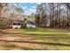 Large backyard with home view and wooded area at 4521 Old Larkin Ct, Wake Forest, NC 27587