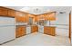 Kitchen with light wood cabinets and white appliances at 4521 Old Larkin Ct, Wake Forest, NC 27587