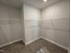 Large walk-in closet with wire shelving and carpeted floor at 453 Edison Rail Ln, Knightdale, NC 27545