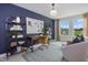 Home office with built-in shelving and a large window at 4912 Caddis Bend, Raleigh, NC 27604