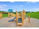 Wooden playground structure with stairs and slide at 700 Longleaf Grove Ln # Virginia102, Knightdale, NC 27545