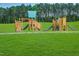 Two wooden playground structures with slides at 700 Longleaf Grove Ln # Virginia102, Knightdale, NC 27545