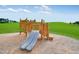 Wooden playset with double slide and climbing features at 708 Longleaf Grove Ln # Virginia104, Knightdale, NC 27545