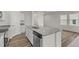 Kitchen island with granite countertops and stainless steel appliances at 7305 Pilatus Ave, Spring Hope, NC 27882