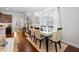 Open dining room with hardwood floors and view of kitchen at 901 Townes Park St, Wake Forest, NC 27587