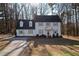 Two-story house with gray siding, gray roof, and red front door at 103 Lakeside Farm Road Rd, Zebulon, NC 27597