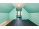 Empty bedroom with light green walls, vaulted ceilings, a window, and dark flooring at 104 Coats Ridge Dr, Benson, NC 27504