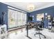 Home office with built-in desk and window views at 10650 Bedfordtown Dr, Raleigh, NC 27614