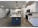 Spacious kitchen with ample counter space, stainless steel appliances, and a view of the staircase at 136 S Mistflower St, Clayton, NC 27520