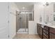 Bathroom with a walk-in shower and dark brown vanity at 154 Alamosa Pl, Cary, NC 27519