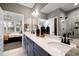 Modern bathroom with double vanity, walk-in shower, and contemporary fixtures at 1788 Farm Pond Trl, Durham, NC 27703