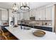 Stylish kitchen with two-tone cabinets, a large center island, and stainless steel appliances at 1788 Farm Pond Trl, Durham, NC 27703