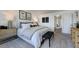 Main bedroom with carpeted floors, a bed with a tufted headboard, and matching nightstands at 261 Hank Way, Angier, NC 27501