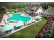 Community pool area with lounge chairs, umbrellas, and a clubhouse at 261 Hank Way, Angier, NC 27501